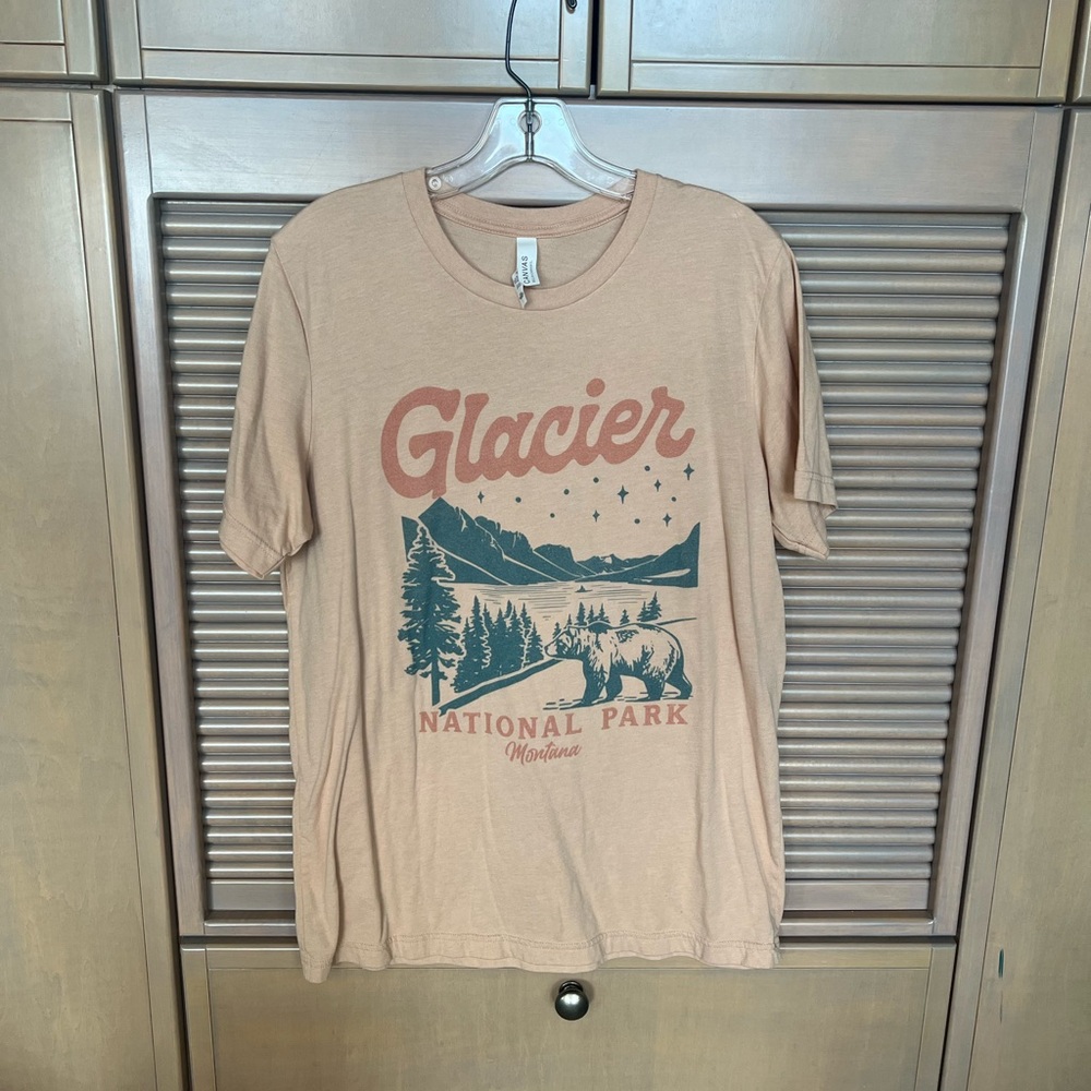 Mountain Moverz. Glacier National Park T. Apricot color.
